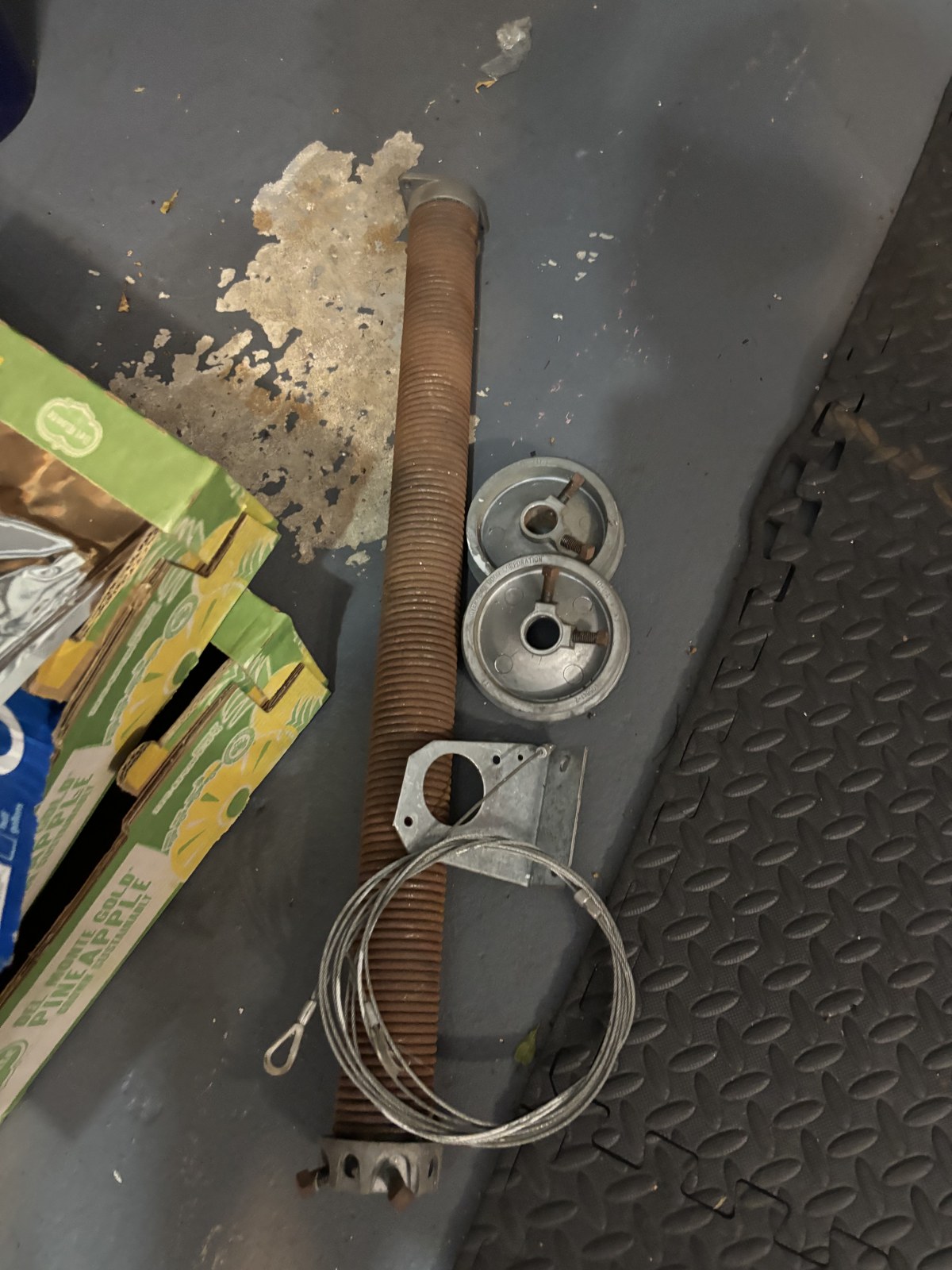 Rusted broken garage door spring removed in North Palm Beach FL