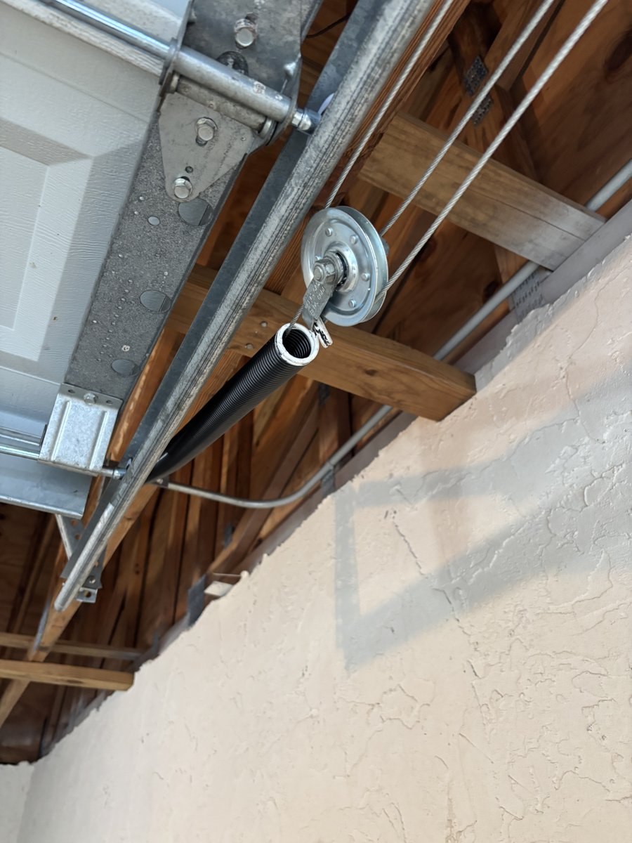 Garage door cable and pulley assembly serviced overhead in Deerfield Beach, FL