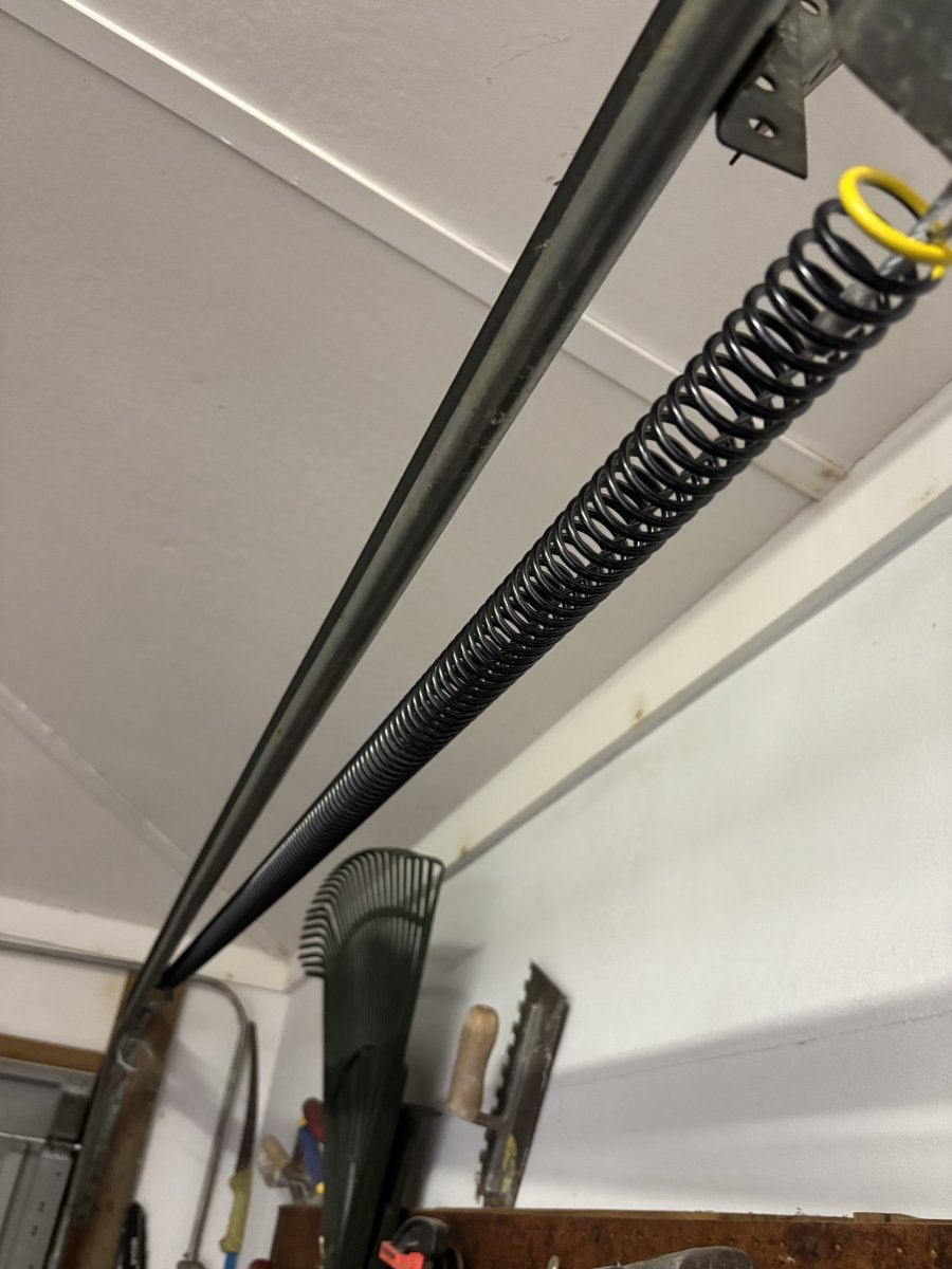 Extension spring and pulley serviced on a Boynton Beach, FL garage door