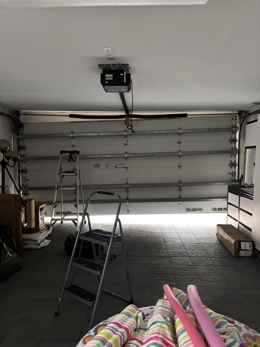 Older garage door opener inspected during a service call