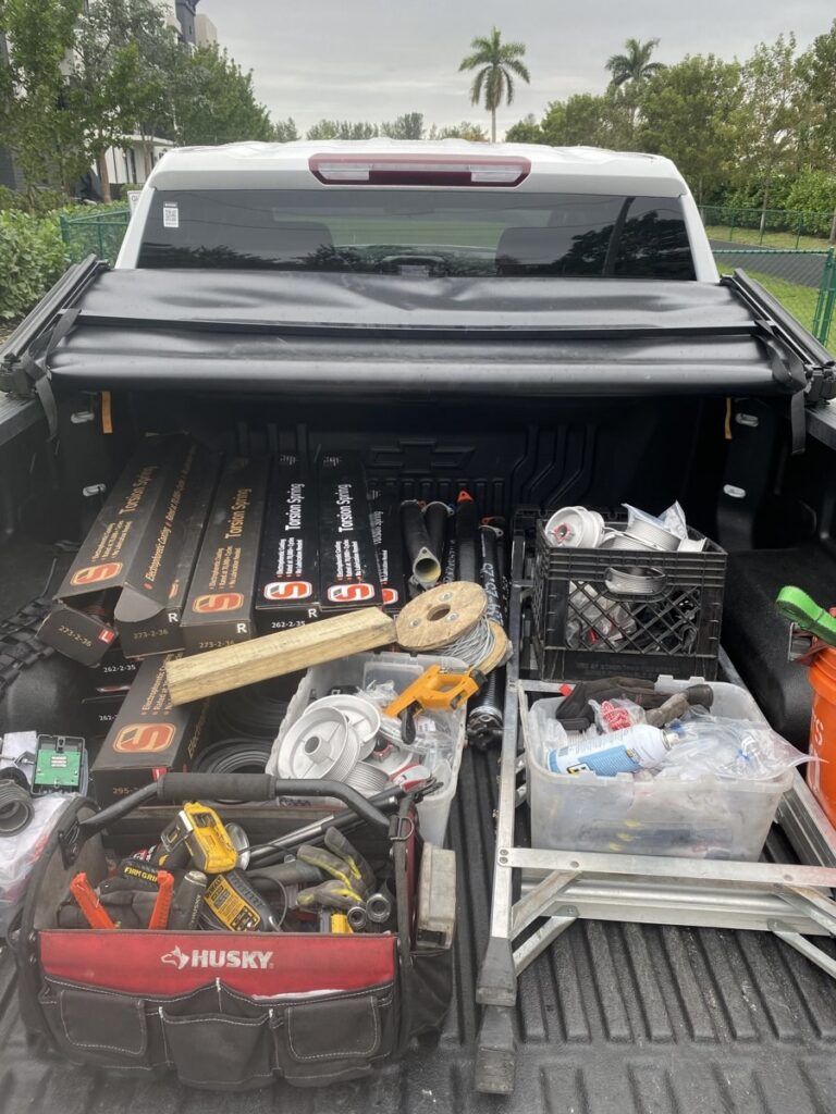 First Garage Door Repair truck loaded with replacement springs for a Boca Raton service call