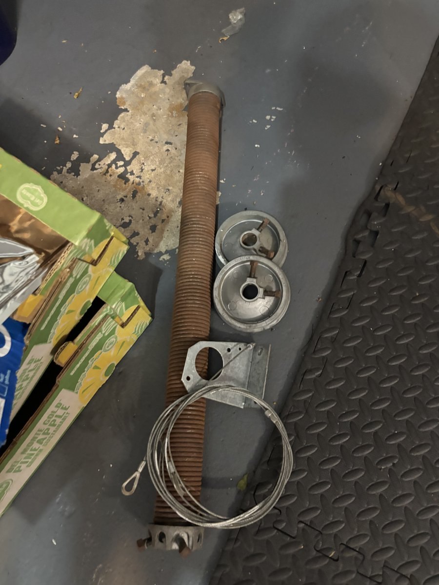 Tools staged for a garage door spring repair in West Palm Beach, FL