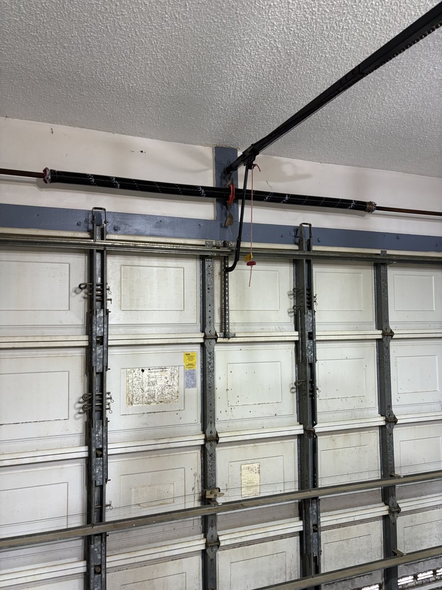 Garage door torsion spring and winding cone serviced