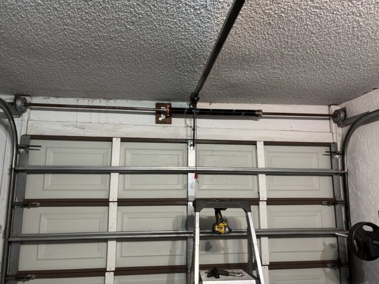 Garage door track and torsion spring repair in progress in Boca Raton, FL