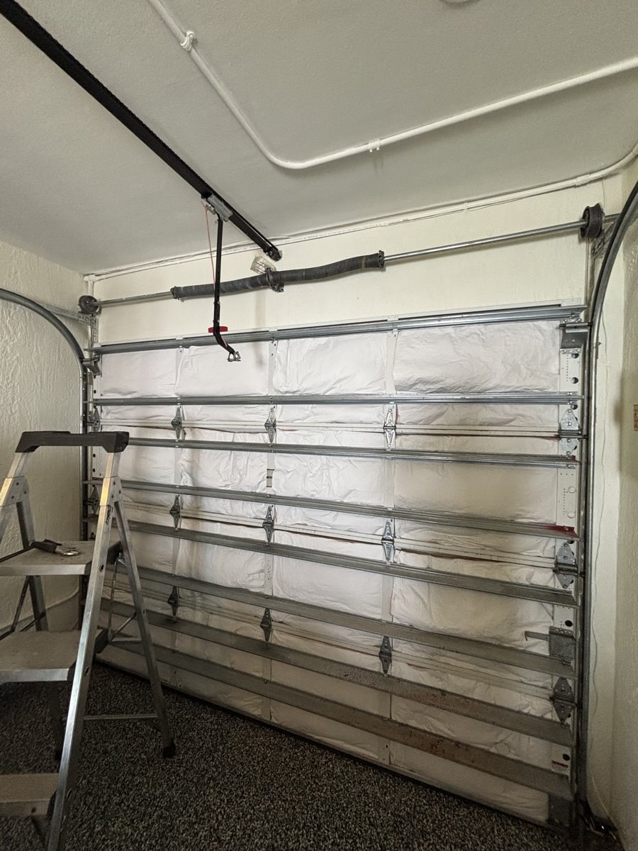 Insulated garage door panels checked during a tune-up in Boca Raton, FL