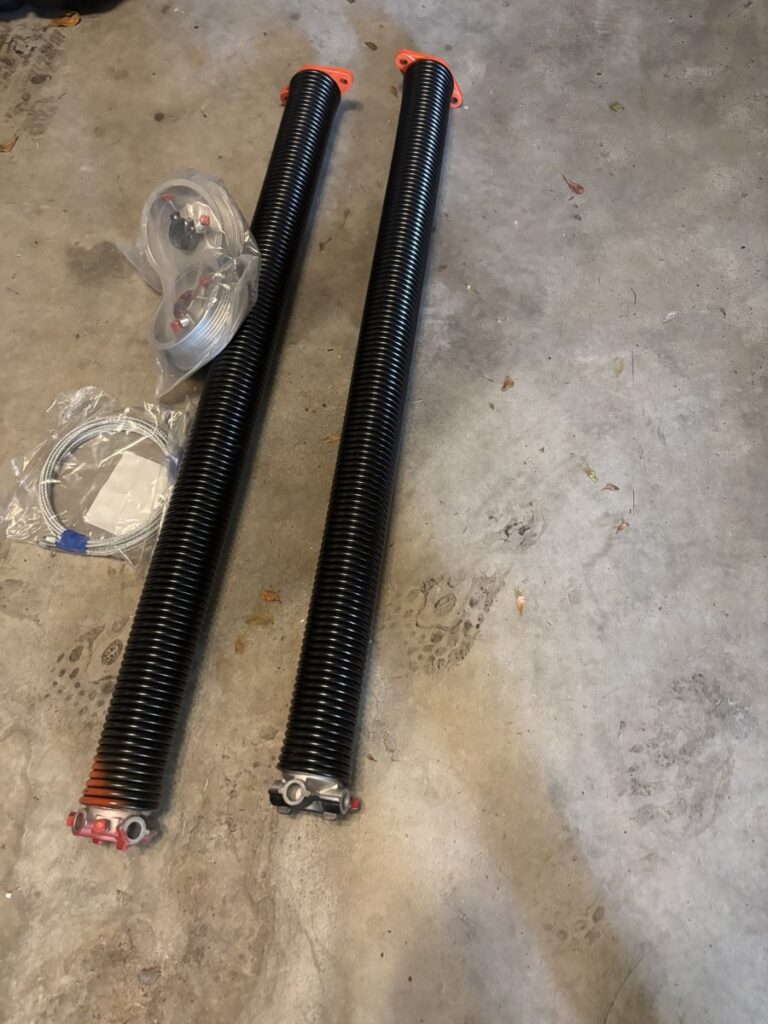 New matched torsion springs installed on a garage door in Boca Raton, FL