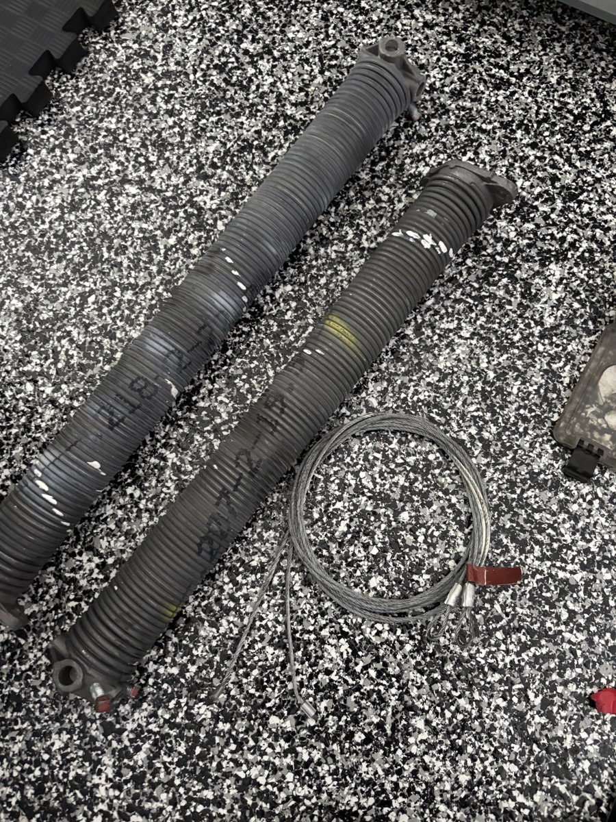 Rusted broken garage door spring removed in South Florida
